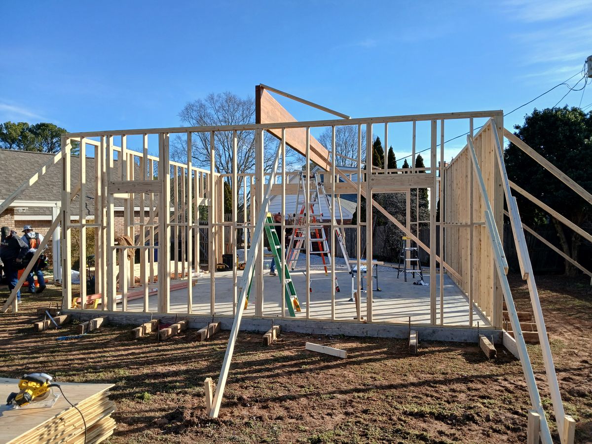 Adams Remodeling crew framing a room addition